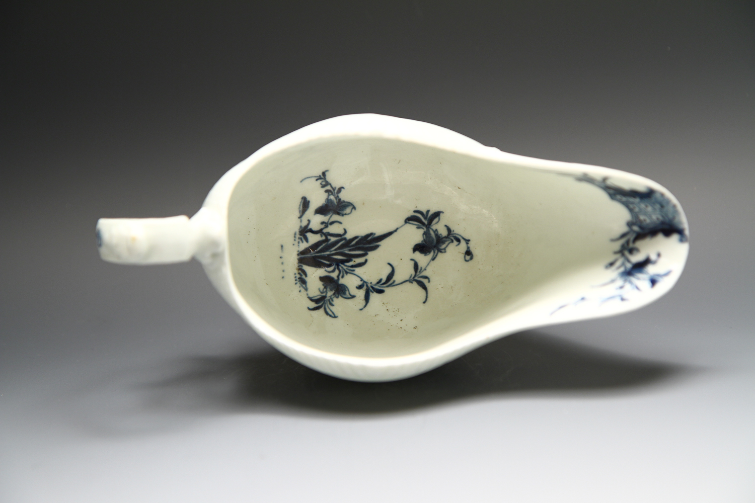 1091 - A good Worcester sauceboat in the Man with Bomb pattern, c 1765-8